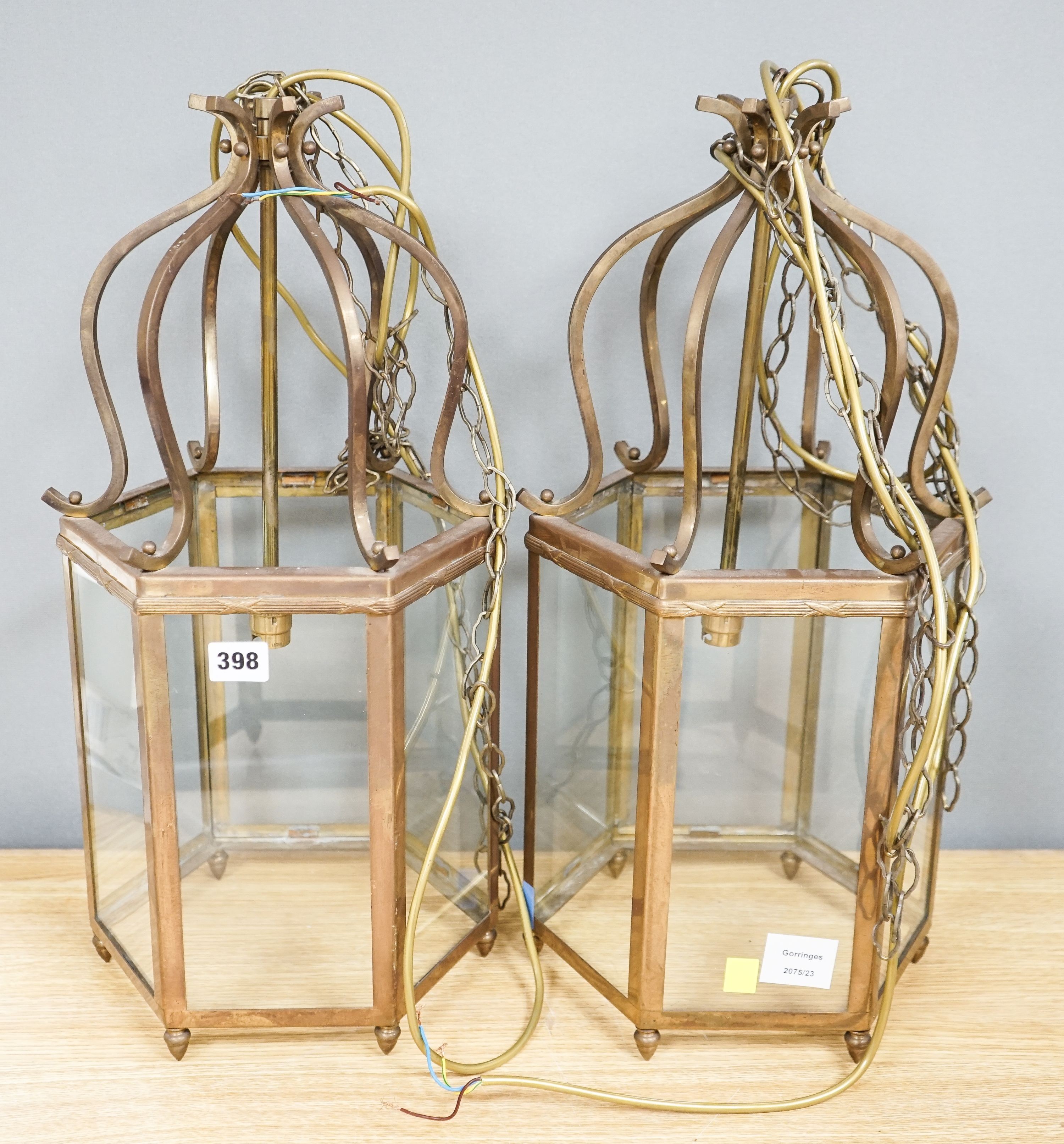 A pair of brass hexagonal lanterns 54cm